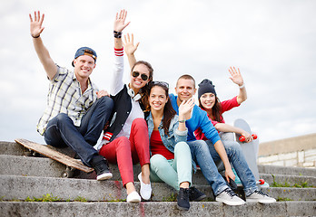 Image showing group of smiling teenagers hanging out