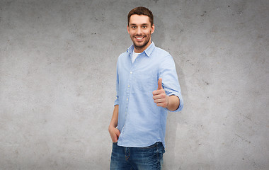 Image showing smiling man showing thumbs up