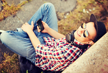 Image showing girl with headphones and smartphone