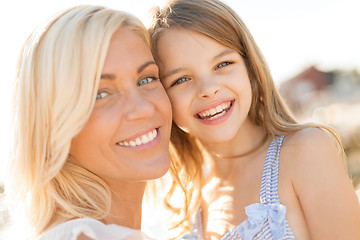 Image showing happy mother and child girl outdoors