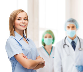 Image showing smiling female doctor or nurse