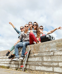 Image showing group of smiling teenagers hanging out