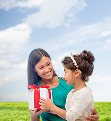 Image showing happy mother and child girl with gift box