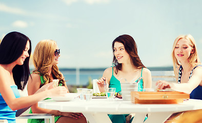 Image showing girls in cafe on the beach