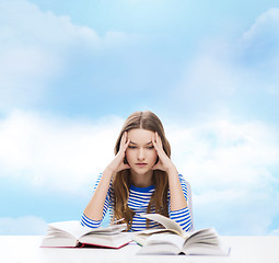 Image showing stressed student girl with books