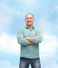 Image showing smiling man with crossed arms