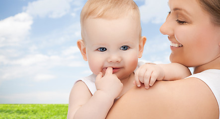 Image showing happy mother with adorable baby