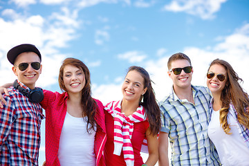 Image showing group of smiling teenagers hanging out