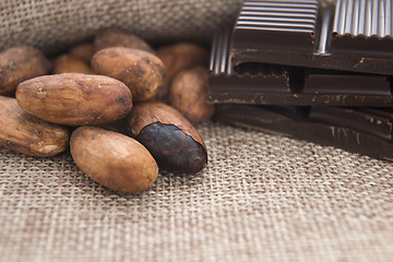 Image showing Cocoa (cacao) beans with chocolate