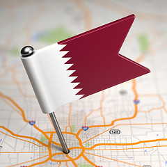 Image showing Qatar Small Flag on a Map Background.