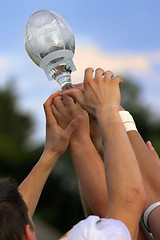 Image showing Hands reaching for a trophy