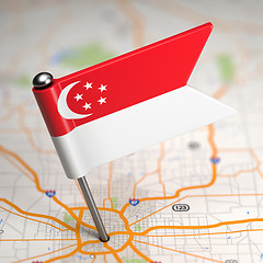 Image showing Singapore Small Flag on a Map Background.