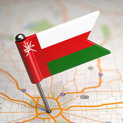 Image showing Oman - Small Flag on a Map Background.