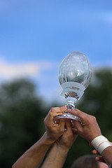 Image showing Hands reaching for a trophy