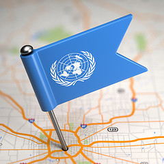 Image showing United Nations Small Flag on a Map Background.