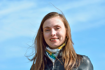 Image showing Portrait of a woman on the sky background