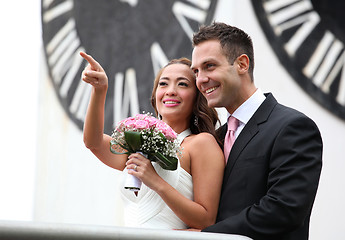 Image showing Young wedding couple showing