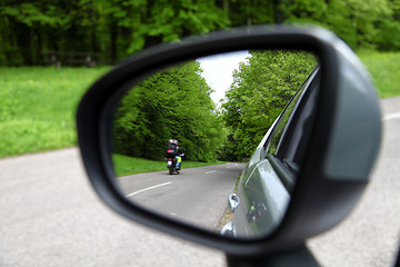 Image showing forest road reflection,  rearview car driving mirror view green 