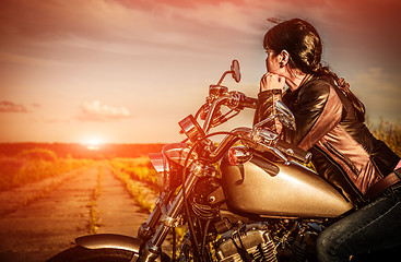 Image showing Biker girl on a motorcycle