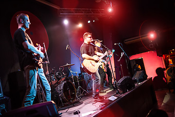 Image showing Band performs on stage in a nightclub