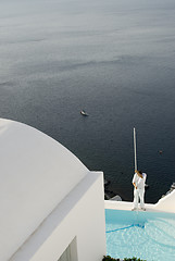 Image showing pool cleaning at villa over sea