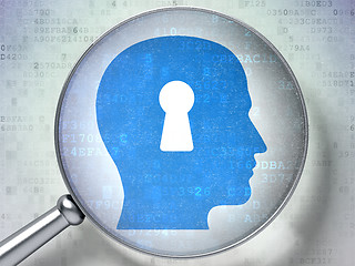 Image showing Security concept:  Head With Keyhole with optical glass on digit