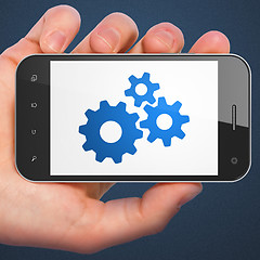 Image showing Business concept: Gears on smartphone