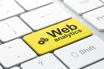 Image showing Web design concept: Gears and Web Analytics on computer keyboard