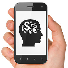 Image showing Finance concept: Head With Finance Symbol on smartphone