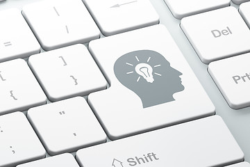 Image showing Advertising concept: Head With Light Bulb on computer keyboard b