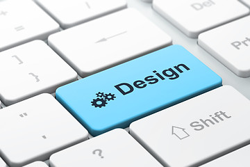 Image showing Advertising concept: Gears and Design on computer keyboard backg