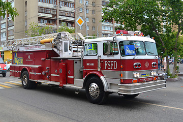 Image showing The fire truck on the city street.