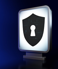 Image showing Protection concept: Shield With Keyhole on billboard background