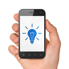 Image showing Finance concept: Light Bulb on smartphone