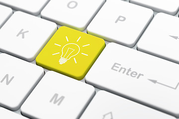 Image showing Finance concept: Light Bulb on computer keyboard background