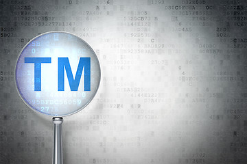 Image showing Law concept:  Trademark with optical glass on digital background