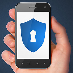 Image showing Safety concept: Shield With Keyhole on smartphone