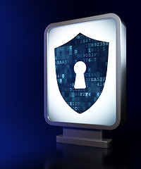 Image showing Security concept: Shield With Keyhole on billboard background