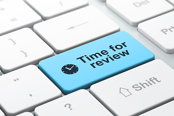 Image showing Timeline concept: Clock and Time for Review on computer keyboard