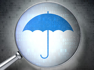 Image showing Security concept:  Umbrella with optical glass on digital backgr