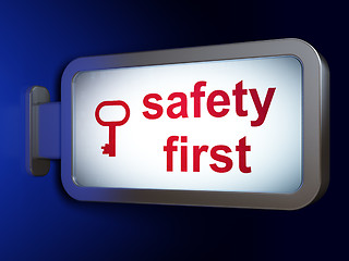 Image showing Protection concept: Safety First and Key on billboard background