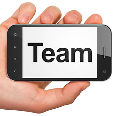 Image showing Business concept: Team on smartphone