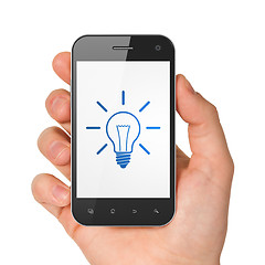 Image showing Finance concept: Light Bulb on smartphone