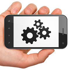 Image showing Information concept: Gears on smartphone