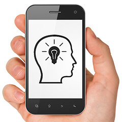 Image showing Advertising concept: Head Whis Lightbulb on smartphone