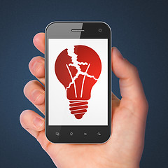 Image showing Business concept: smartphone with Light Bulb.