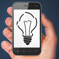 Image showing Business concept: smartphone with Light Bulb.