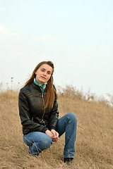 Image showing Woman in jeans and a black leather jacket