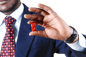 Image showing Closeup of man holding dice.