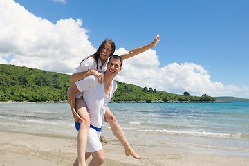 Image showing happy couple have fun on the beach